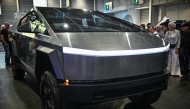 Photo used for demonstration purposes. Visitors look at a Tesla Cybertruck car displayed at the Paris Motor Show at Paris Expo Porte de Versailles in Paris on October 16, 2024. Photo by JULIEN DE ROSA / AFP.

