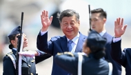 China's President Xi Jinping waves upon his arrival for the Asia-Pacific Economic Cooperation (APEC) Summit at Air Force Base 8, annexed to the Jorge Chavez International Airport, in Callao, Peru, on November 14, 2024. (Photo by Ernesto Benavides / AFP)
