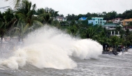 Large waves break along a seawall ahead of the expected landfall of Super Typhoon Man-yi, in Legaspi City, Albay province on November 16, 2024. (Photo by CHARISM SAYAT / AFP)
