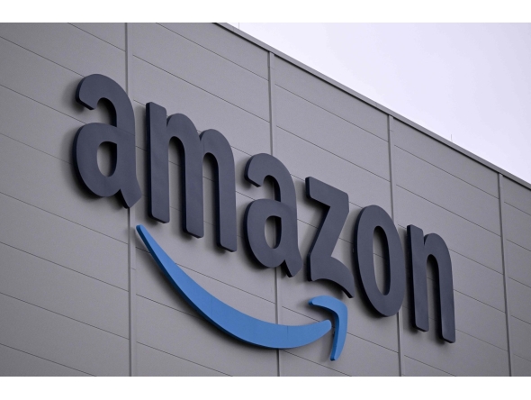 The logo of US online retail giant Amazon is seen on the facade of a redistribution centre in Horn-Bad Meinberg, western Germany, on December 9, 2024. (Photo by Ina FASSBENDER / AFP)