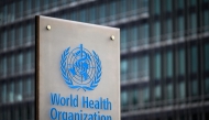 File: This photograph taken on December 7, 2021 shows a sign of the World Health Organisation (WHO) at their headquarters in Geneva. (Photo by Fabrice Coffrini / AFP)
