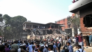 Onlookers gather after protesters stormed Bangabandhu Memorial Museum, the residence of Sheikh Mujibur Rahman, independent Bangladesh's first president and father of the country's ousted Prime Minister Sheikh Hasina, at Dhanmondi 32 in Dhaka on February 6, 2025. (Photo by Munir Uz Zaman / AFP)
