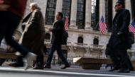 People walk by Wall Street on February 04, 2025 in New York City. (Photo by SPENCER PLATT / GETTY IMAGES NORTH AMERICA / Getty Images via AFP)
