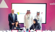 Minister of Communications and Information Technology  H E Mohammed bin Ali bin Mohammed Al Mannai witnessing the signing of the partnership initiative by Assistant Undersecretary for Digital Industry Affairs at MCIT  H E Reem Al Mansoori and General Manager of Microsoft Qatar, Lana Khalaf at the Web Summit Qatar 2025.