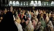 Muslim women offer first Tarawih prayers to mark the start of the Islamic holy fasting month of Ramadan, at Baiturrahman Grand Mosque in Banda Aceh on February 28, 2025. (Photo by YASUYOSHI CHIBA / AFP)
