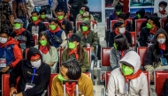 Indonesian nationals, who were victims of human trafficking in Myanmar, arrive at Soekarno–Hatta International Airport in Tangerang, Banten province, on February 28, 2025, after being flown from Thailand, following their handover by the Myanmar government to Thailand. Myanmar handed over 84 Indonesians to Thailand on February 27, officials said, the latest group of alleged scam centre workers set to be repatriated from the region. (Photo by DENNYS / AFP)
