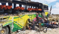 Handout picture released by Bolivian Police shows the wreckage of a bus that collided with another one on a highway near Uyuni, Bolivia on March 1, 2025. (Photo by Handout / Bolivian Police / AFP)