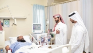QNB officials interacting with a patient at Fahad Bin Jassim Kidney Centre. 