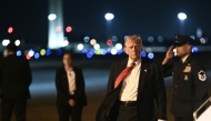 US President Donald Trump steps off Air Force One as he arrives at Palm Beach International Airport in West Palm Beach, Florida, on March 14, 2025. (Photo by Brendan SMIALOWSKI / AFP)
