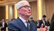 Apple CEO Tim Cook attends the opening ceremony of the China Development Forum at the Diaoyutai State Guesthouse in Beijing on March 23, 2025. (Photo by Adek Berry / Pool / AFP)
