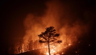 A wildfire spreads in Andong on March 26, 2025. (Photo by Yasuyoshi Chiba / AFP)