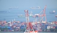 A general view shows containers and cranes at the international port of Manila on April 3, 2025. Photo by Ted ALJIBE / AFP