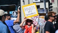 A protester holds a sign during a 