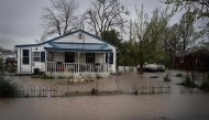 Water surrounds a home on April 05, 2025 in Wilson City, Missouri. Photo by SCOTT OLSON / GETTY IMAGES NORTH AMERICA / Getty Images via AFP