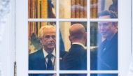 (Files) (L-R) Senior Counselor to the President for Trade and Manufacturing, Peter Navarro, White House deputy chief of staff for policy and US homeland security advisor Stephen Miller, and Elon Musk speak inside the Oval Office of the White House on March 14, 2025. (Photo by Roberto Schmidt / AFP)
