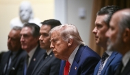 US President Donald Trump (C) looks on during a cabinet meeting in the Cabinet Room of the White House on April 10, 2025, in Washington, DC. Photo by Brendan SMIALOWSKI / AFP.