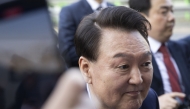 Ousted South Korean president Yoon Suk Yeol (L) leaves the official residence in Seoul on April 11, 2025. (Photo by JEON HEON-KYUN / POOL / AFP)
