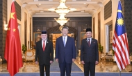 Chinese President Xi Jinping, Malaysian King Sultan Ibrahim Sultan Iskandar, and Malaysian Prime Minister Anwar Ibrahim pose for a group photo in Kuala Lumpur, Malaysia, April 16, 2025. (Xinhua/Xie Huanchi)
