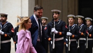 Italy's Prime Minister, Giorgia Meloni welcomes U.S. Vice President JD Vance at Palazzo Chigi prior their meeting in Rome on April 18, 2025. (Photo by Kenny HOLSTON / POOL / AFP)
