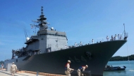 This handout photo taken and released on April 19, 2025 by the Embassy of Japan in Cambodia shows Royal Cambodian Navy personnel (foreground) securing the Japan Maritime Self-Defense Force (JMSDF) mine countermeasures vessel JS Bungo during docking at the Ream Naval Base. (Photo by Handout / Embassy of Japan in Cambodia / AFP) 