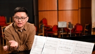 Nurzhyguit Moldoyar, singer, composer and student at the K. Moldobasanov Kyrgyz National Conservatory, who participates in a competition to create a new national anthem for Kyrgyzstan, together with fellow musicians and collaborators performs his composition he submitted to the contest, in Bishkek on April 5, 2025. Photo by Guliza Urustambek kyzy / AFP.
