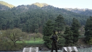 An Indian paramilitary serviceman keeps watch in Pahalgam, south of Srinagar on April 23, 2025, following an attack. (Photo by Tauseef Mustafa / AFP)