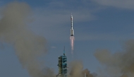 A Long March-2F carrier rocket, carrying the Shenzhou-20 spacecraft and a crew of three astronauts, lifts off from the Jiuquan Satellite Launch Centre in the Gobi desert, in northwest China on April 24, 2025. (Photo by Pedro Pardo / AFP)