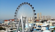 This drone photo taken on April 25, 2025 shows a Ferris wheel at Qingdao Polar Ocean Park in Qingdao, east China's Shandong Province. The Ferris wheel was put into operation here on Friday. (Xinhua/Li Ziheng)
