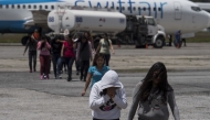 File: Migrants arrive from Texas at a repatriation center in Guatemala City. (Photo by Carolyn Van Houten/The Washington Post)
