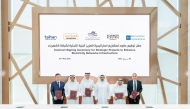 Minister of State for Energy Affairs H E Saad Sherida Al-Kaabi (third right) and other officials at the contracts signing ceremony yesterday. (STORY ON PAGE 1)