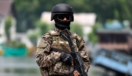 An Indian paramilitary personnel stands guard along the banks of Dal Lake in Srinagar on May 6, 2025. (Photo by Sajjad HUSSAIN / AFP)
