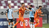 Umm Salal's Antonio Mance (centre) celebrates after scoring against Al Wakrah yesterday. 