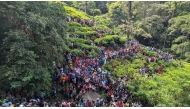 People gather near the site of a bus accident in Kotmale, Sri Lanka on May 11, 2025.  (Photo by Gayan Sameera/Xinhua)
