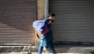 Shruti Sharma who had fled her border home in Kashmir's Poonch, returns on May 14, 2025. Photo by Money SHARMA / AFP.

