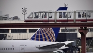 Passengers ride the air train at Newark Liberty International Airport in Newark, New Jersey on May 7, 2025. (Photo by Kena Betancur / AFP)