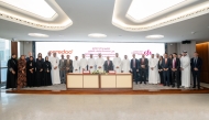 Commercial Bank and Ooredoo officials during the agreement signing.