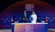 Officials during the signing ceremony at Qatar Economic Forum.