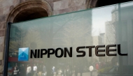 (Files) The logo of Japan's largest steel manufacturer Nippon Steel corporation is seen in front of the company's head office in Tokyo on April 10, 2025. (Photo by Kazuhiro Nogi / AFP)
