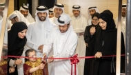 Katara General Manager Prof. Dr. Khalid bin Ibrahim Al Sulaiti joins a student in inaugurating the exhibition yesterday.