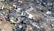 Firefighters work at the site where a South Korean navy maritime patrol aircraft crashed on a mountain in Pohang on May 29, 2025. (Photo by YONHAP / AFP)
