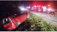 This handout photo taken and released by Perak's Fire and Rescue Department on June 9, 2025 shows a minivan after it collided with a bus in Gerik-Jeli, in Malaysia's Perak state. (Photo by Handout / Perak's Fire and Rescue Department / AFP) 