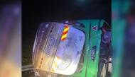 This handout photo taken and released by Perak's Fire and Rescue Department on June 9, 2025 shows a bus after it collided with a minivan in Gerik-Jeli, in Malaysia's Perak state. (Photo by Handout / Perak's Fire and Rescue Department / AFP)