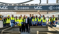 Officials and staff during the unveiling of the 3D construction printer. 
