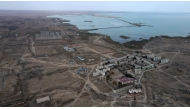 (Files) An aerial view shows the village of Ulken (foreground) and the proposed nuclear power plant site near in the village of Ulken, on September 22, 2024. (Photo by Ruslan Pryanikov / AFP)