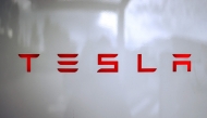 A photo shows the Tesla logo on a charging station (Tesla Supercharger) in Chasse-sur-Rhone, central France, on June 6, 2025. (Photo by Alex Martin / AFP)