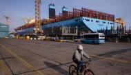 This file photo taken on December 3, 2014 shows a general view of an under-construction Maersk triple-E class container ship at the Daewoo DSME shipyard in Okpo, 60km south of Busan. Photo by ED JONES / AFP