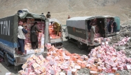 Workers unload expired and low-quality food items in Kabul, the capital of Afghanistan, July 15, 2025. (Photo by Saifurahman Safi/Xinhua)
