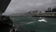 Dark clouds gather and rough seas are seen in Victoria harbour as the typhoon signal number 10 is hoisted as Typhoon Wipha moves towards Hong Kong on July 20, 2025. (Photo by Peter PARKS / AFP)