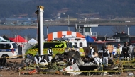 Recovery teams work at the scene where a Jeju Air Boeing 737-800 series aircraft crashed and burst into flames at Muan International Airport in Muan, some 288 kilometres southwest of Seoul on December 30, 2024. Photo by JUNG YEON-JE / AFP