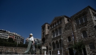 Photo used for representational purposes. A pedestrian walks near the church Agios Dimitrios during a heatwave in Thessaloniki on July 24, 2025. Photo by Sakis Mitrolidis / AFP.
